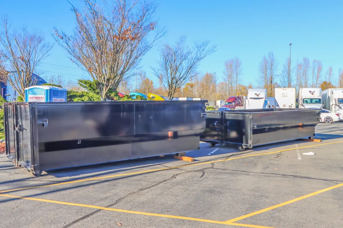 Professional dumpster rental service with roll-off container on residential driveway in Richton Park